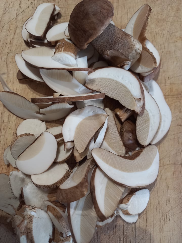 sliced porcini mushrooms on a chopping board