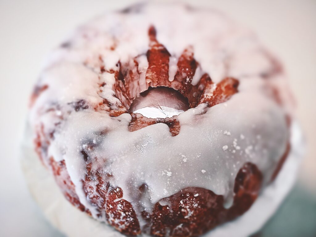 Apple bundt cake with white frosting on top