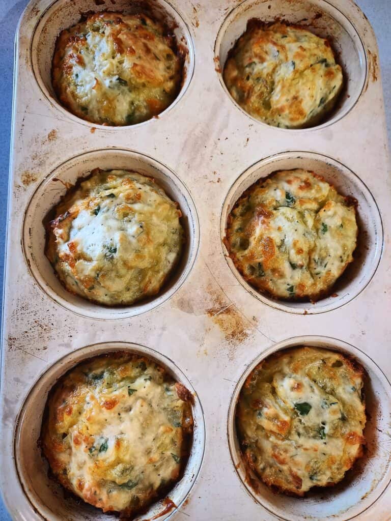 baked cheese and onion rolls in a 6 muffin tin