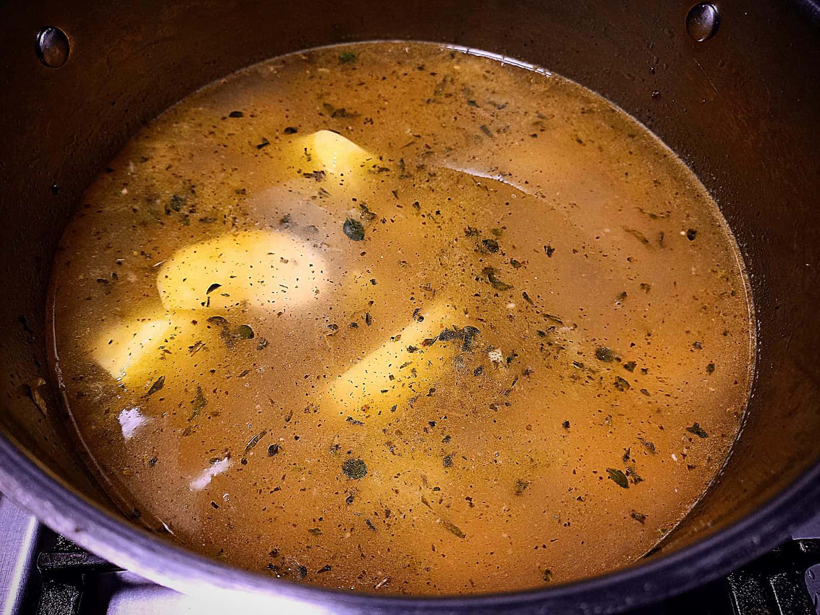 Potato soup ingredients in a large sauce pan
