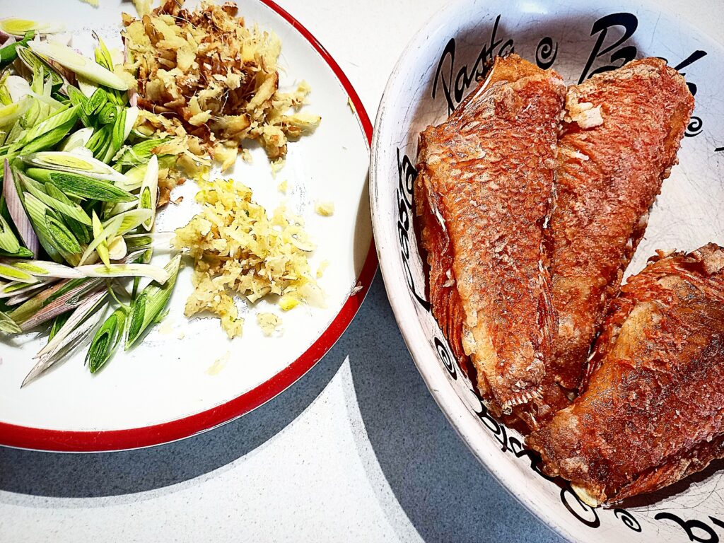 3 Pan fried scarlette wrasse on a plate and the ingredients for the xo sauce on a different plate