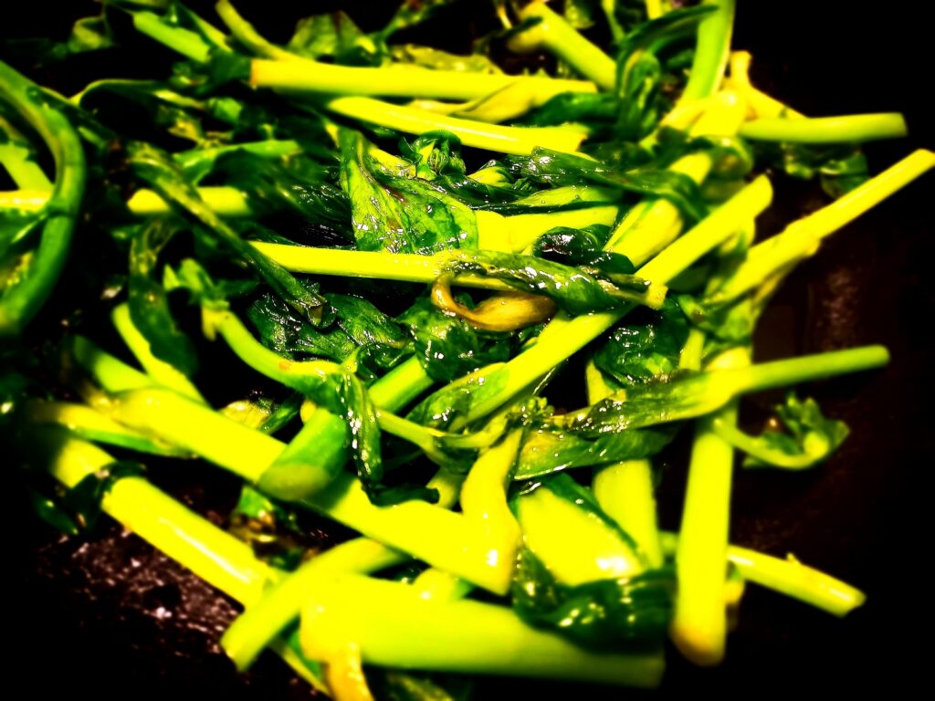 Sauteed Chinese greens in a frying pan