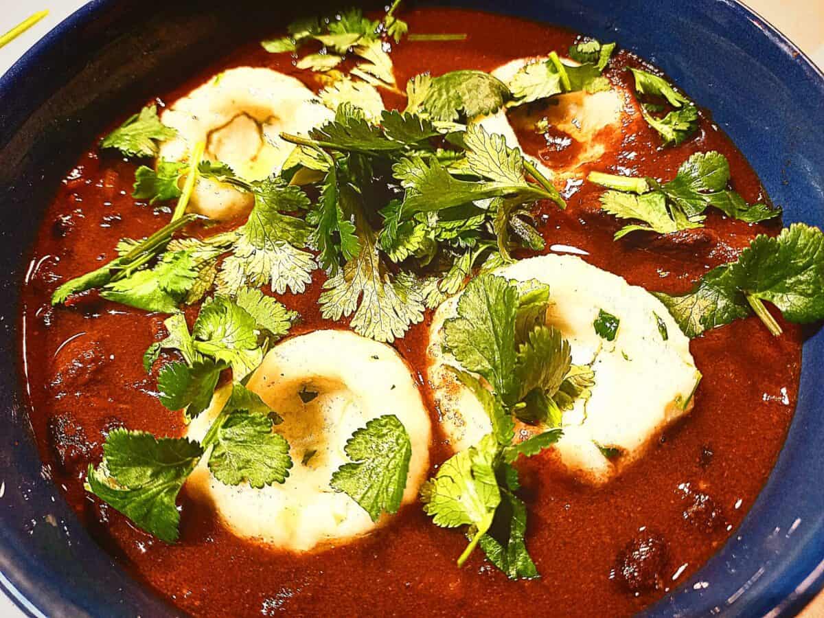 Venison, black bean chilli topped with 4 mexican dumplings and chopped coriander