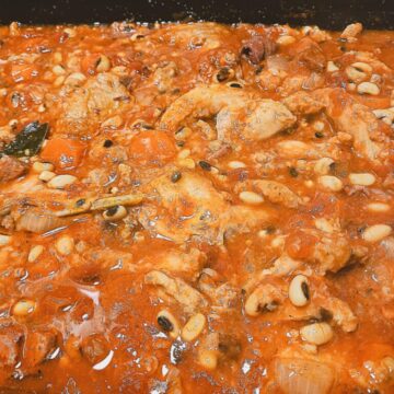Rabbit and bean casserole in a large oven dish