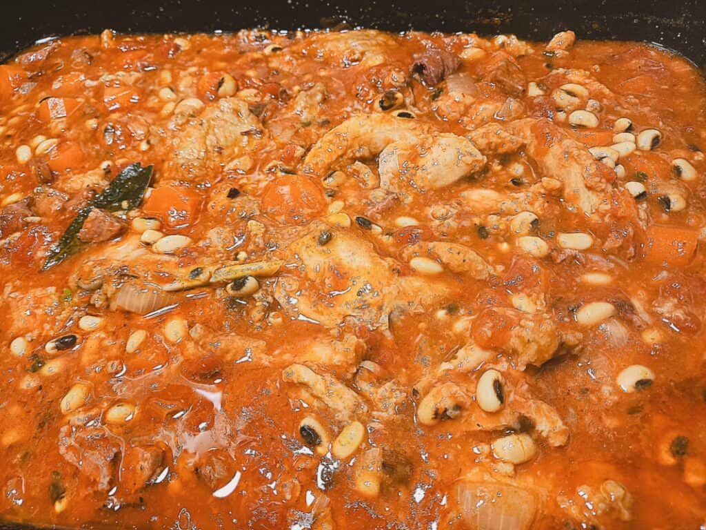 Rabbit and bean casserole in a large oven dish