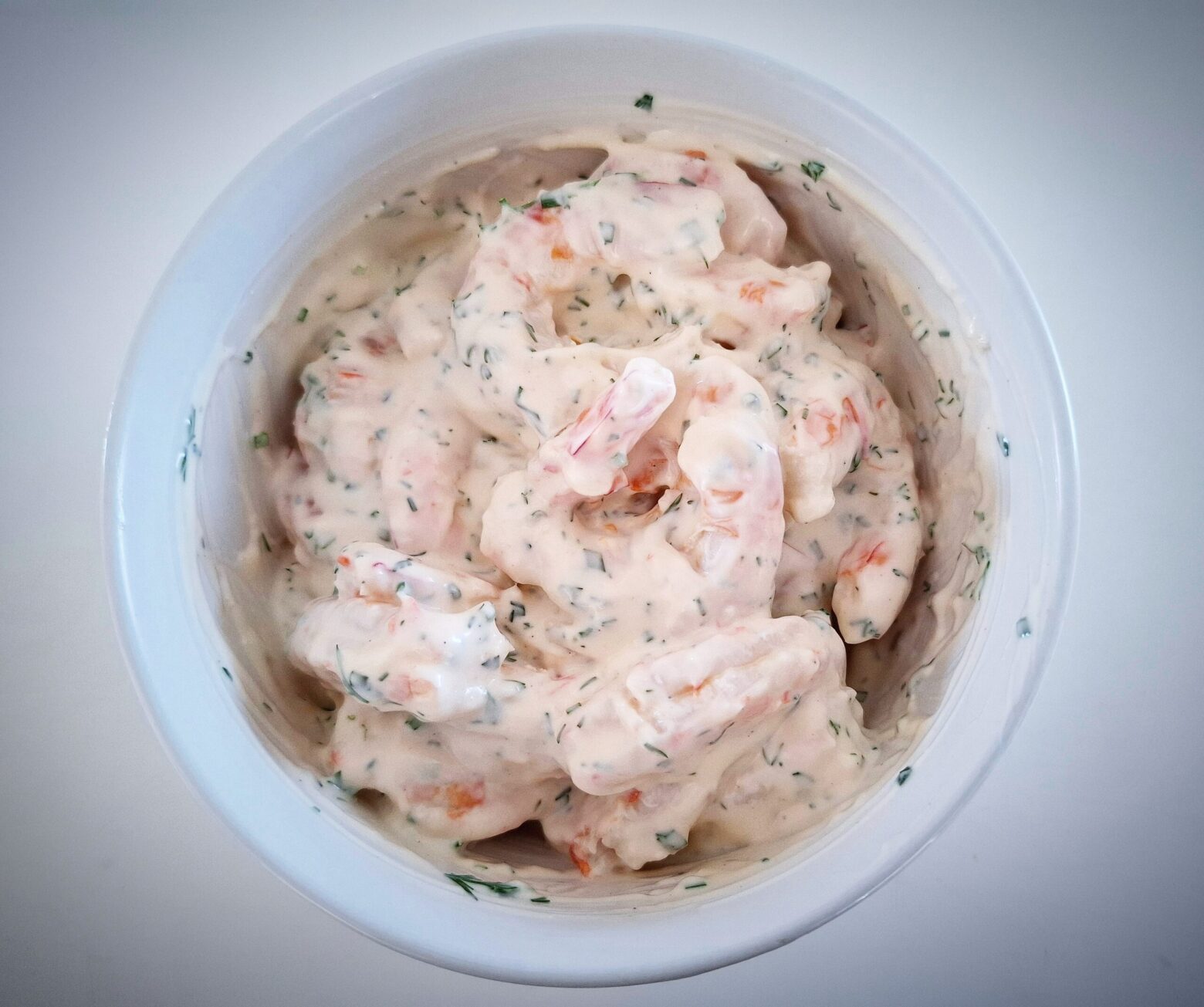 prawn skagen in a white bowl on a white table
