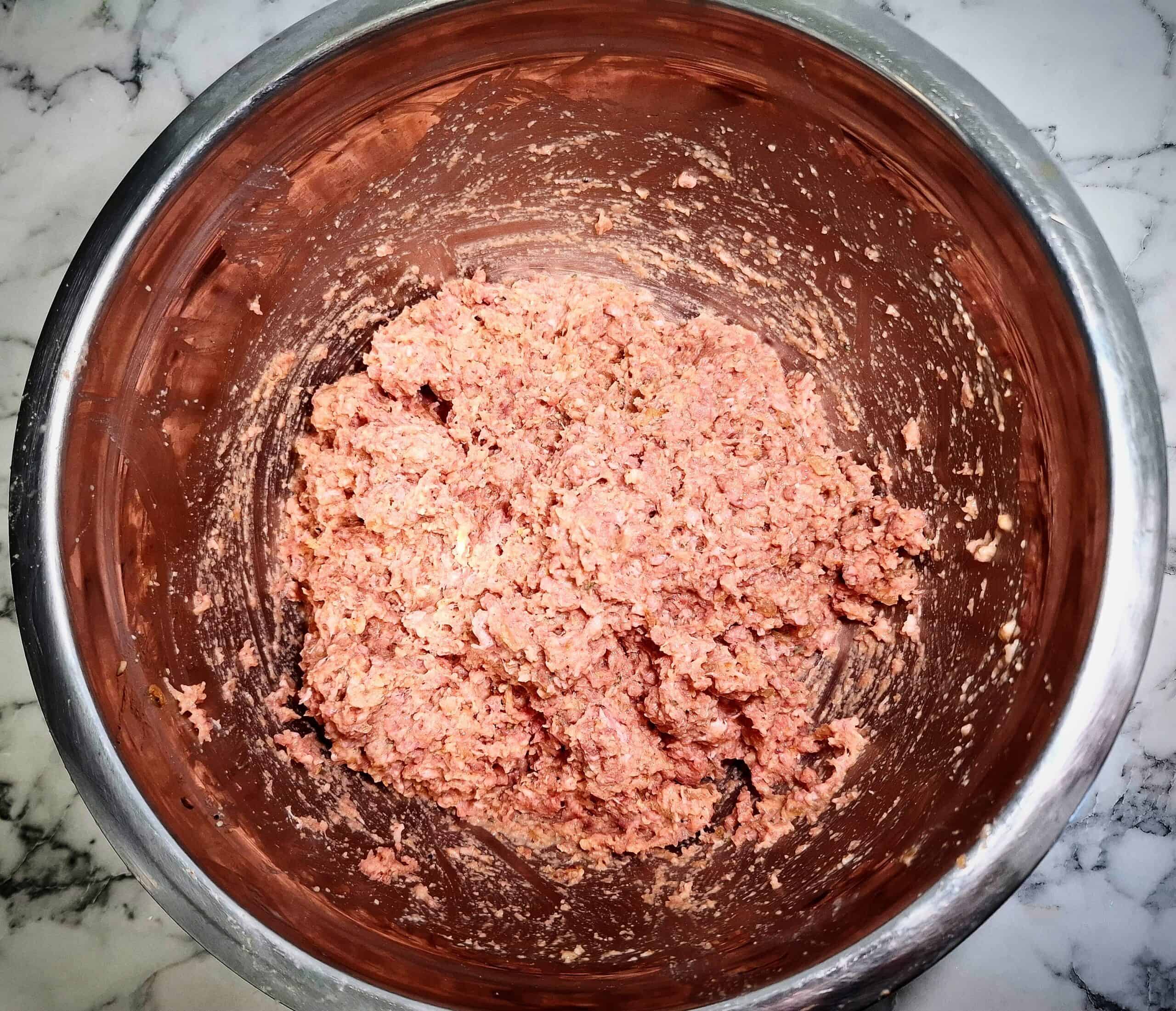 Meatballs mixture ready in a stainless steel bowl