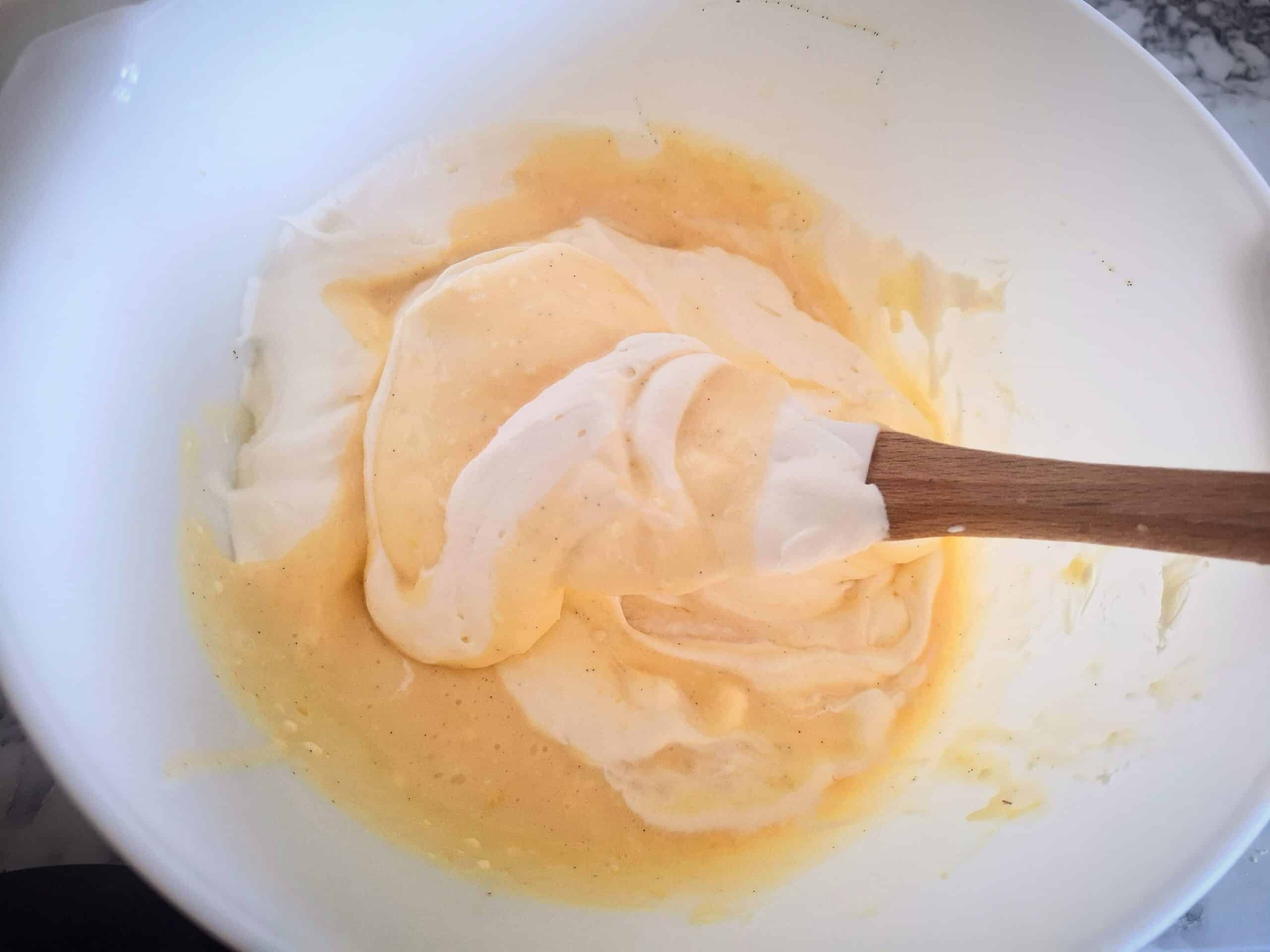 Whipped cream is mixed through the cheesecake mixture.