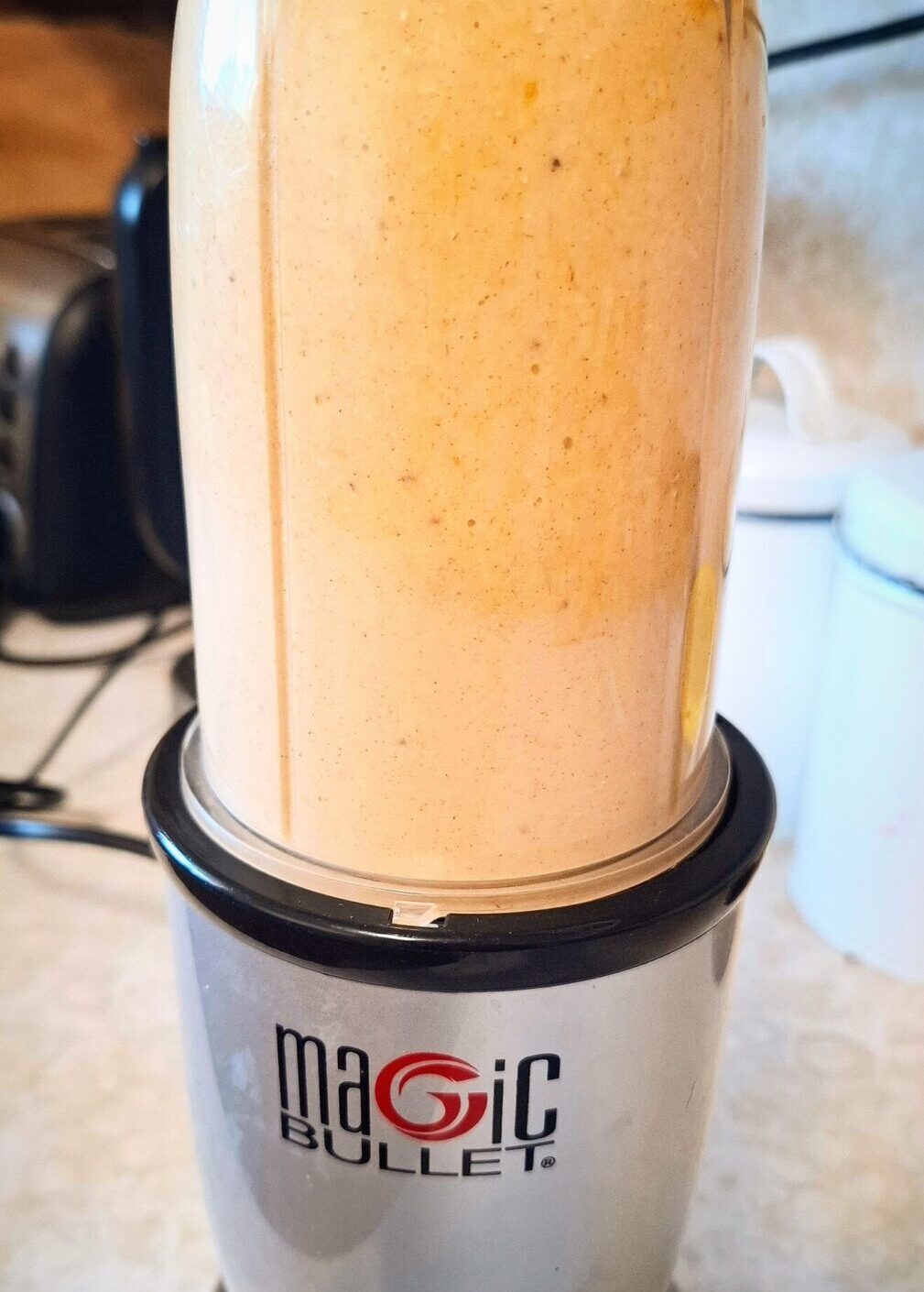 Mixing the ingredients for banana pikelets in a nutri bullet blender.